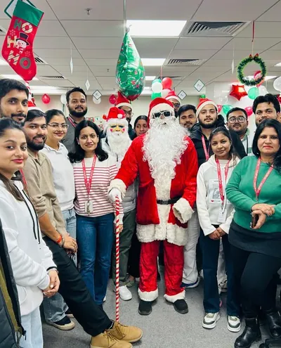 A festive gathering in the office decorated for the holidays