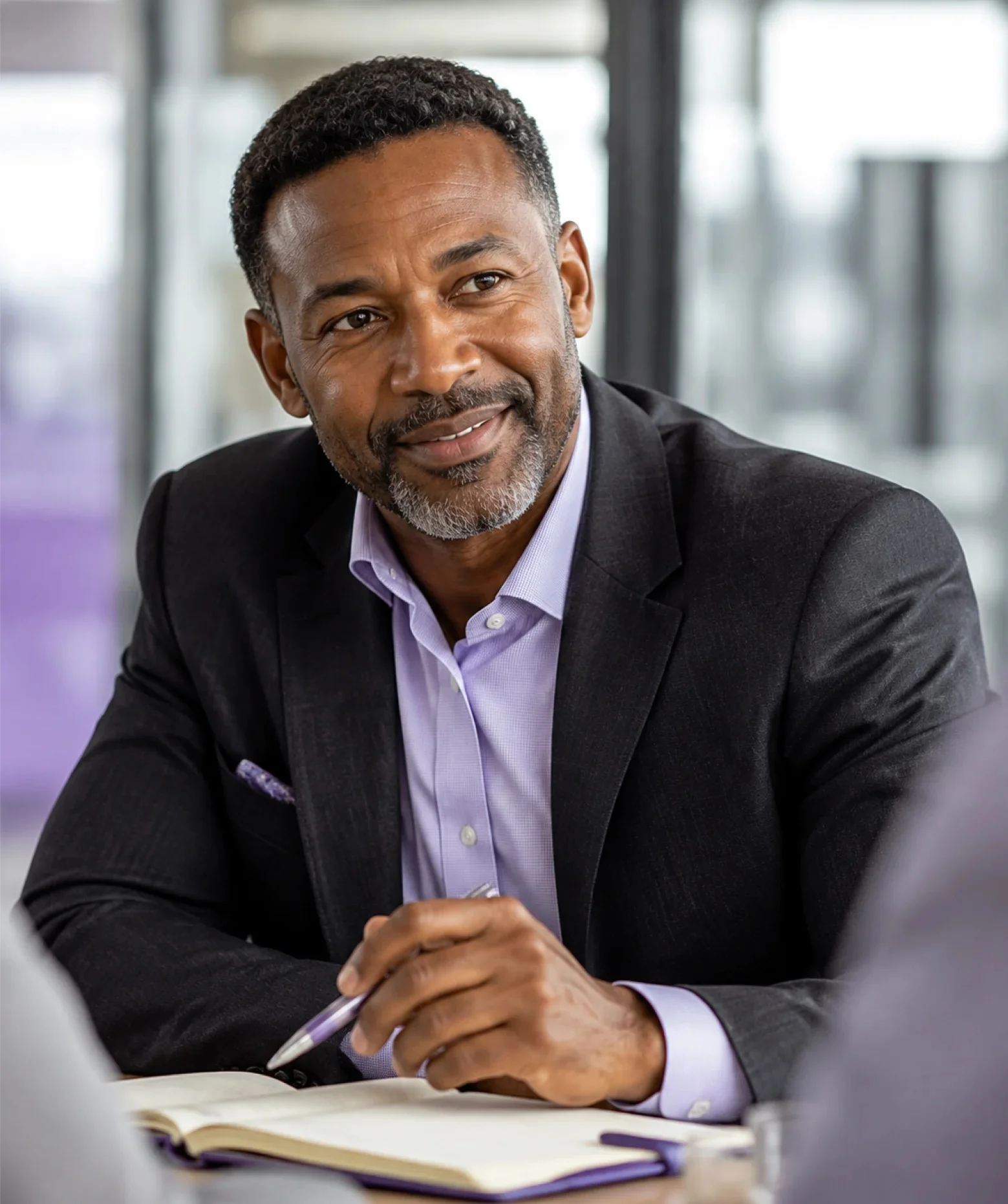A mortgage operations lead talking through a file across a desk